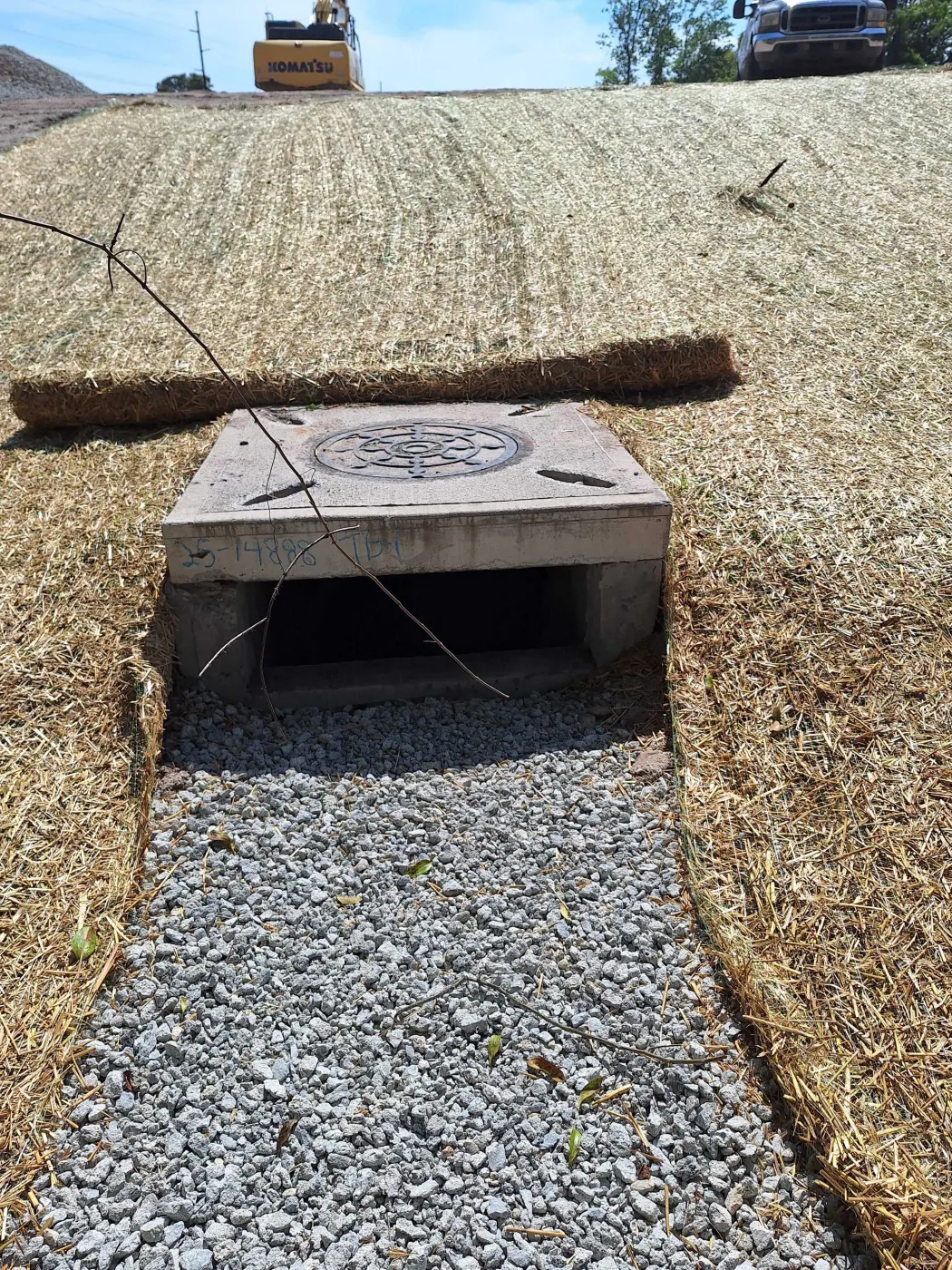 Concrete culvert and rock spillway on a drainage outlet