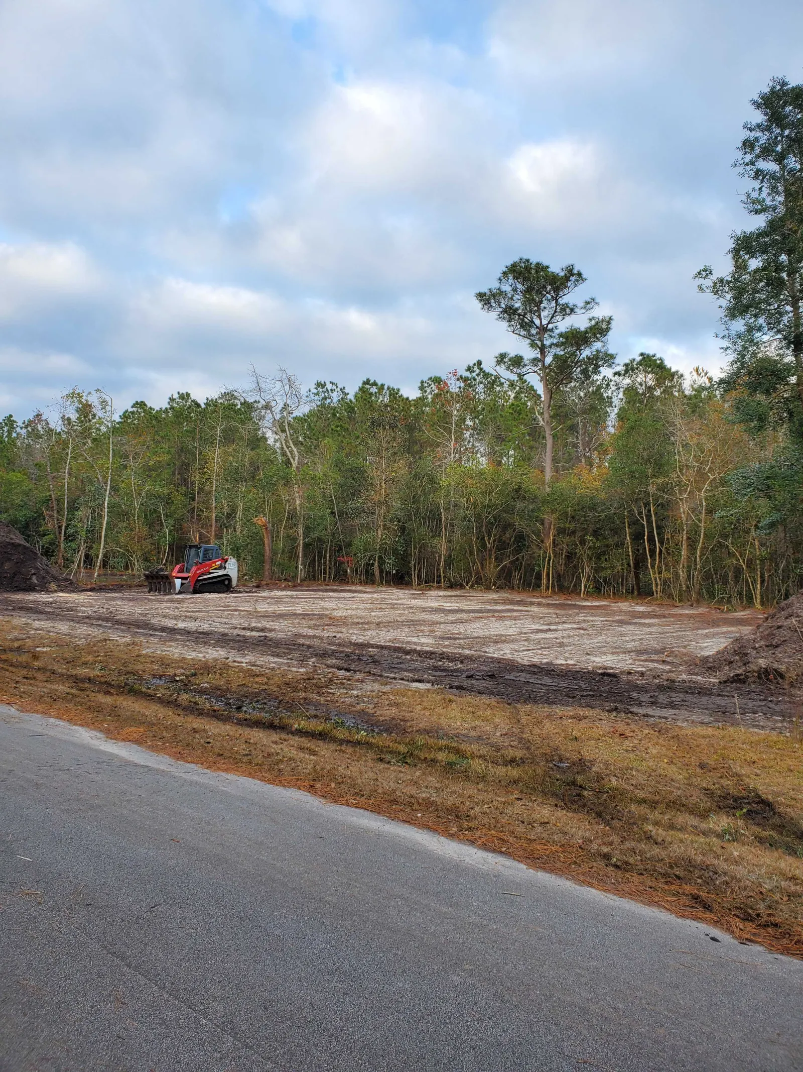 Cleared and graded land in Burgaw, NC with the tree line pushed back