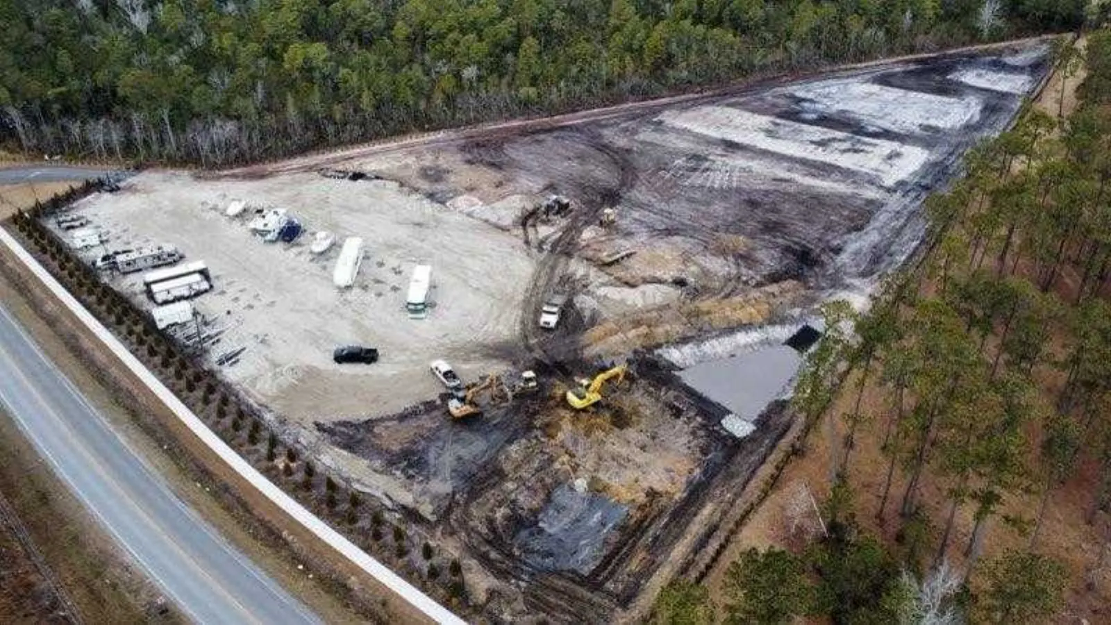 Aerial view of a cleared and graded site off the highway in Pender County