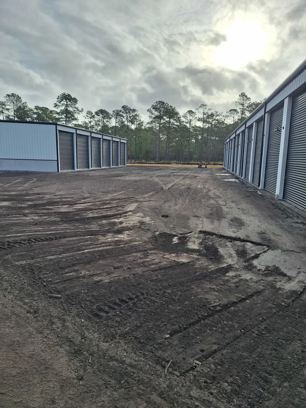 Grading between rows of storage buildings
